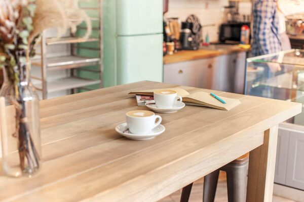 red table setting for coffee on the counter at coffee house -